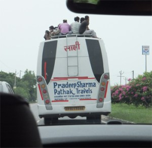 Bus with roof travelers